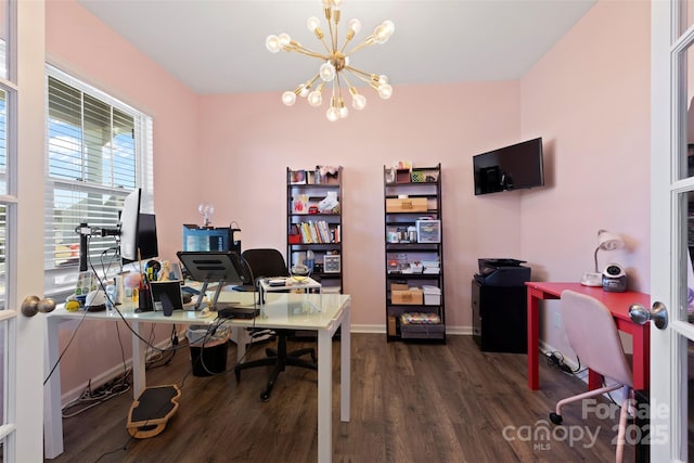 home office with baseboards, a notable chandelier, and dark wood-style flooring