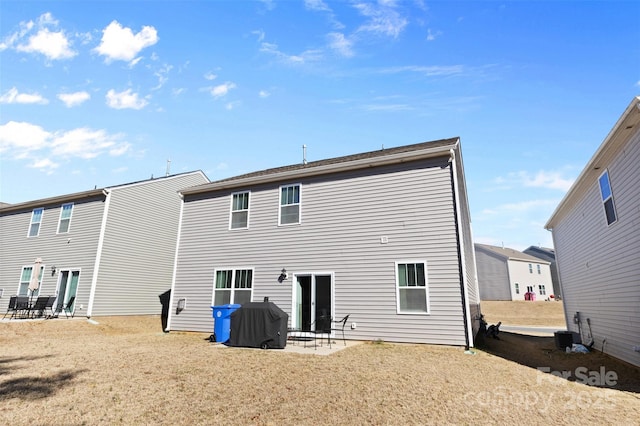 back of house with cooling unit and a patio area