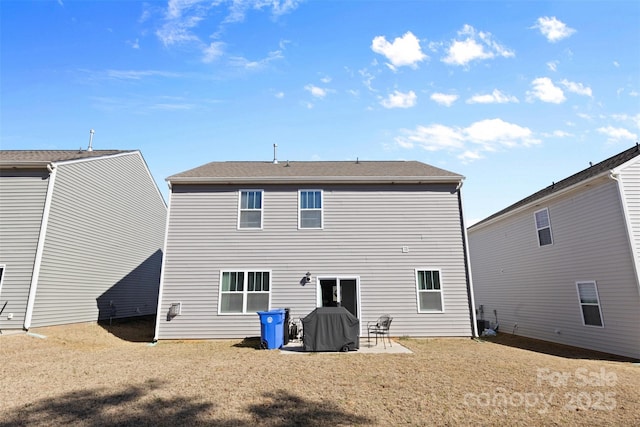 rear view of house featuring a patio area