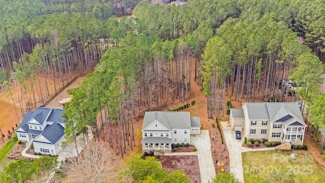 drone / aerial view with a view of trees