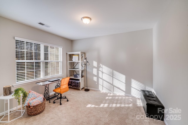 home office with carpet, visible vents, and baseboards