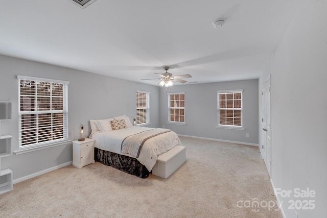 bedroom with visible vents, baseboards, a ceiling fan, and carpet flooring