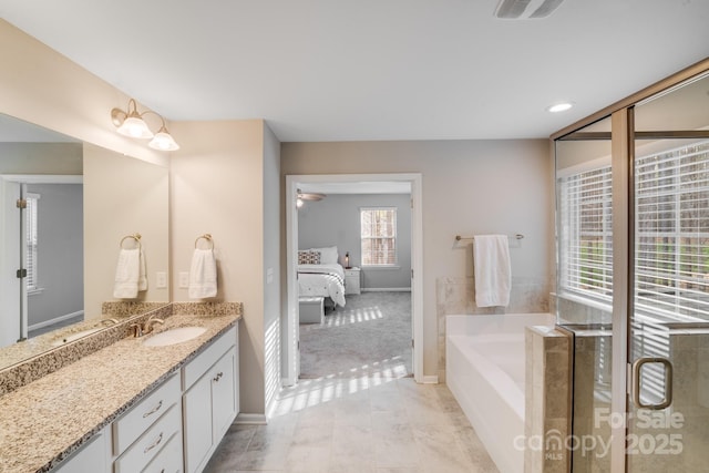 full bath with visible vents, ceiling fan, a garden tub, ensuite bathroom, and vanity