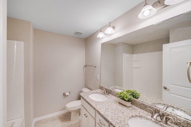 full bathroom featuring a sink, visible vents, toilet, and double vanity