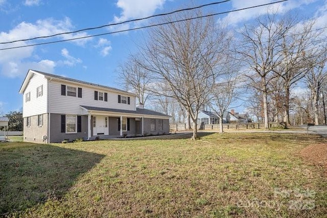 view of front of home featuring covered porch and a front lawn