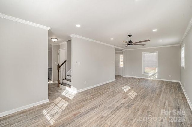 empty room with recessed lighting, baseboards, stairs, light wood finished floors, and crown molding