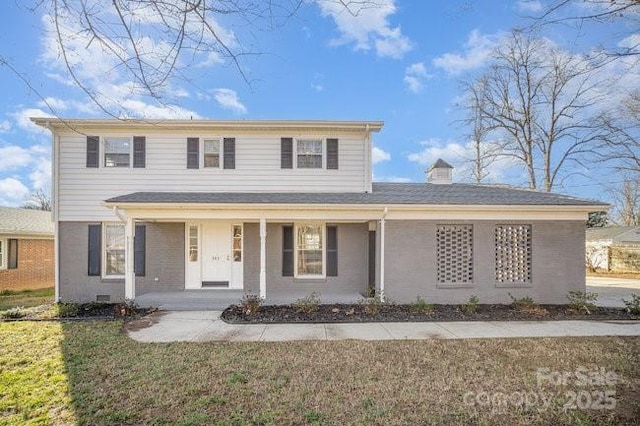 traditional-style home featuring a porch, crawl space, and a front lawn