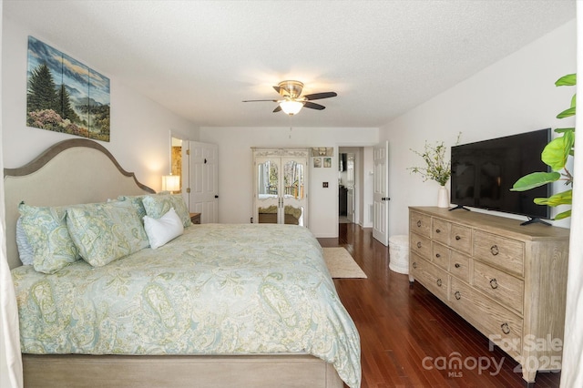 bedroom with a ceiling fan, dark wood-style flooring, and a textured ceiling