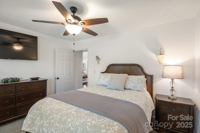 bedroom featuring carpet flooring and a ceiling fan