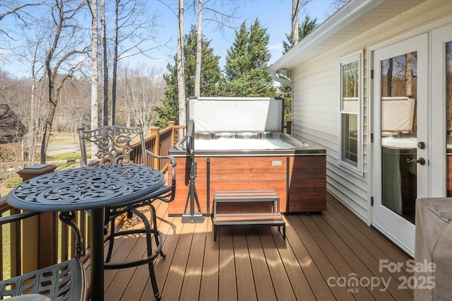 deck featuring a hot tub