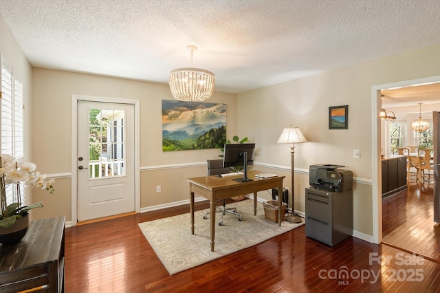 office area featuring dark wood-style floors and a chandelier