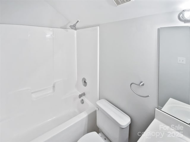 full bath with visible vents, a sink, toilet, and tub / shower combination