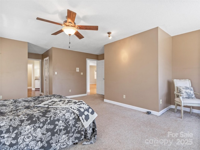 carpeted bedroom with a ceiling fan and baseboards