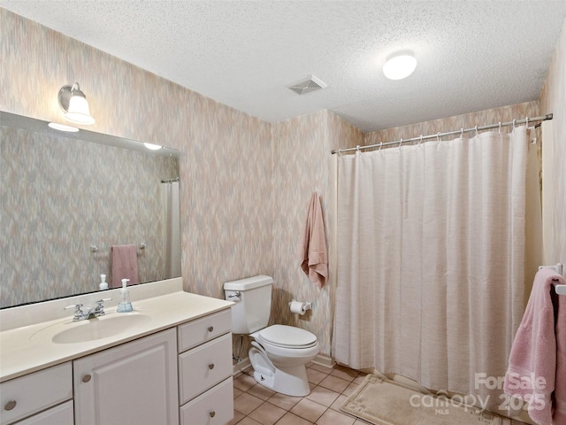 bathroom with visible vents, wallpapered walls, a textured ceiling, tile patterned floors, and toilet