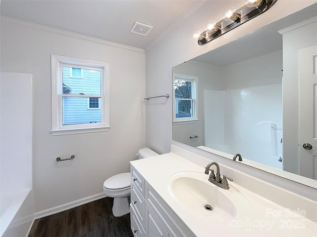 full bathroom with visible vents, toilet, wood finished floors, crown molding, and vanity