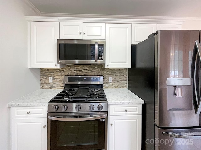 kitchen with stainless steel appliances, white cabinetry, and decorative backsplash