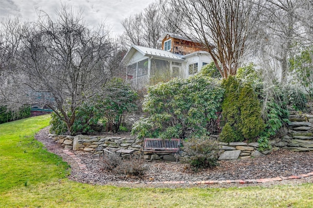 view of yard featuring a sunroom