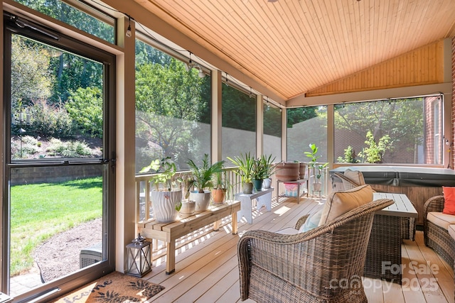 sunroom featuring wood ceiling and vaulted ceiling