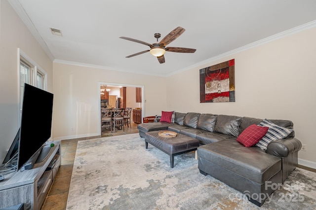 living area featuring baseboards, visible vents, crown molding, and ceiling fan