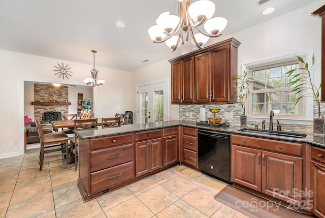 kitchen featuring an inviting chandelier, black dishwasher, a sink, and backsplash