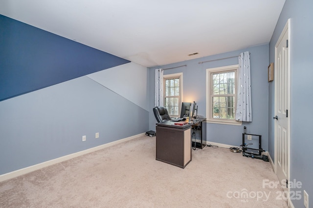 carpeted office featuring baseboards and visible vents