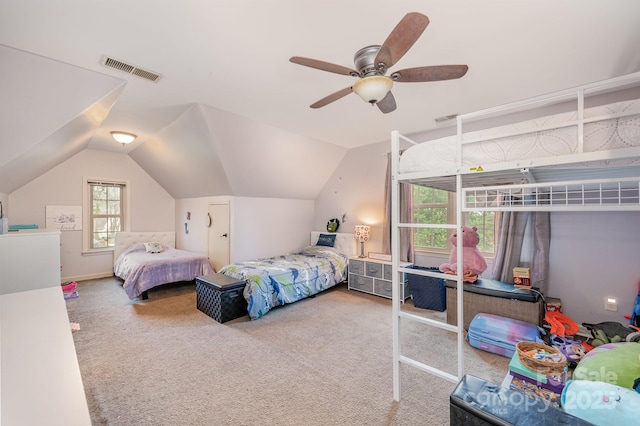 bedroom featuring a ceiling fan, carpet, lofted ceiling, and visible vents