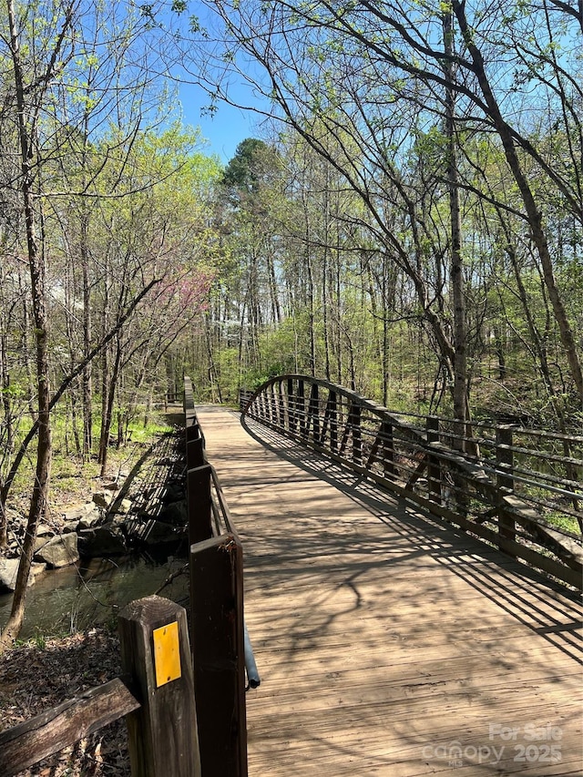 surrounding community featuring a forest view