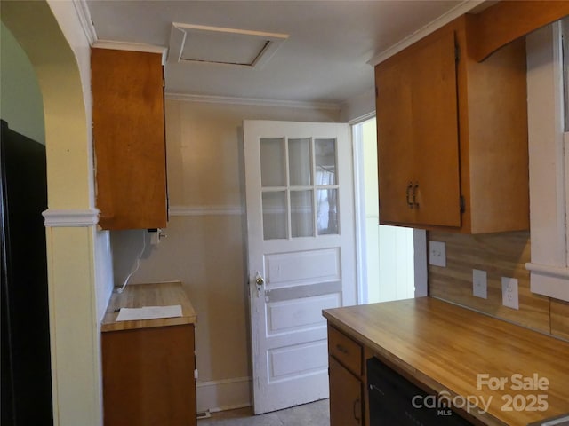 kitchen with ornamental molding and brown cabinetry