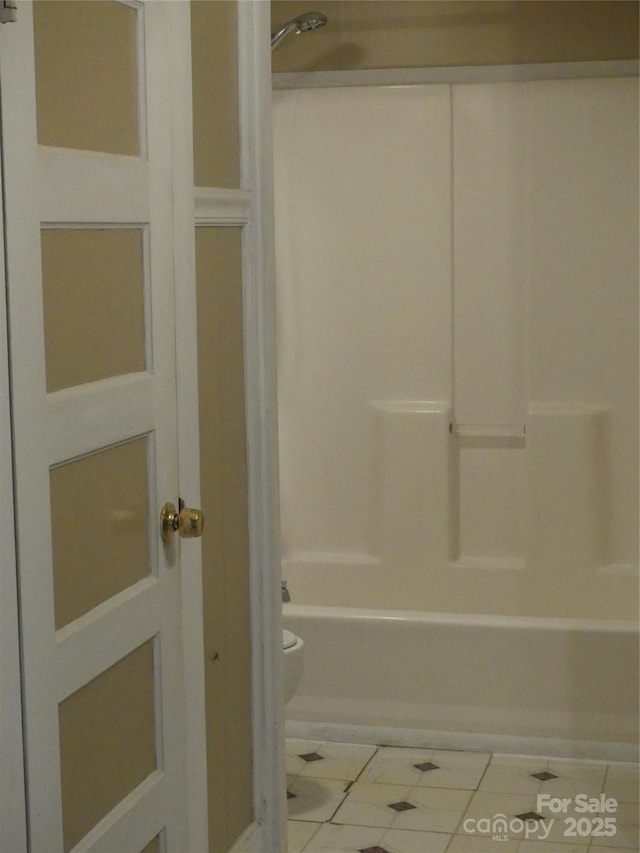 bathroom with toilet, bathing tub / shower combination, and tile patterned floors