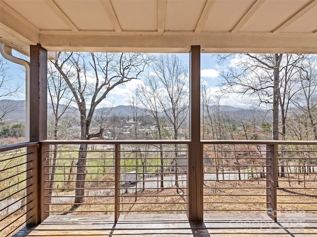 wooden terrace featuring a mountain view