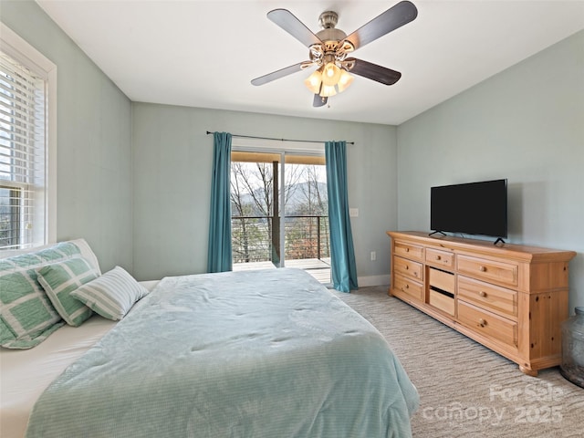 bedroom with light carpet, ceiling fan, and baseboards