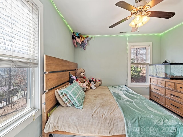 bedroom featuring visible vents and a ceiling fan