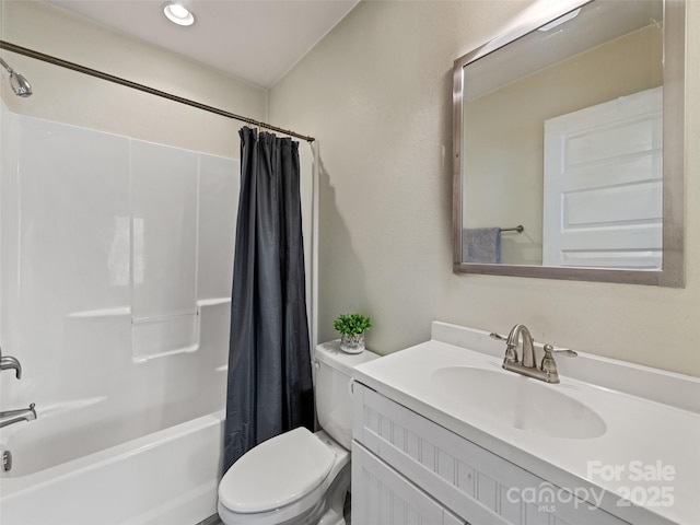 bathroom with toilet, shower / bath combination with curtain, and vanity