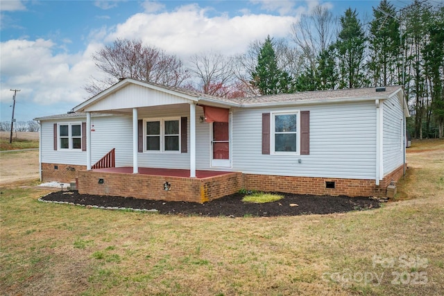 view of front of home with a porch, a front yard, and crawl space