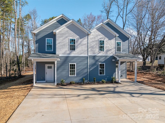 view of front of house featuring concrete driveway