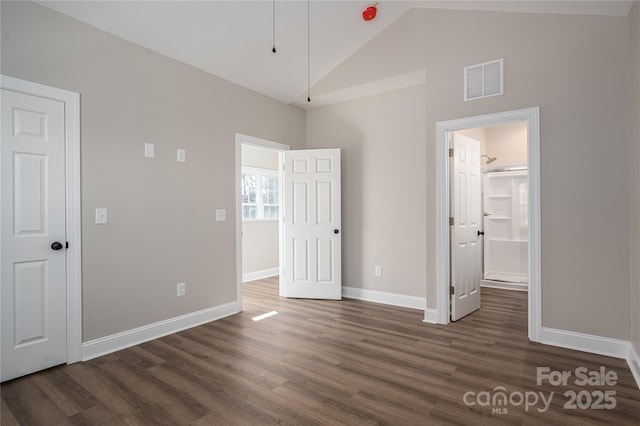 unfurnished bedroom with dark wood-type flooring, visible vents, and baseboards