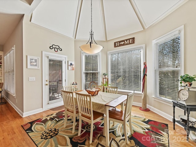 dining area with baseboards and light wood-style floors