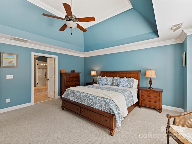 carpeted bedroom featuring a tray ceiling, visible vents, ornamental molding, a ceiling fan, and baseboards