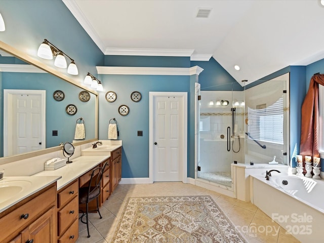 full bath featuring double vanity, a garden tub, crown molding, and tile patterned floors