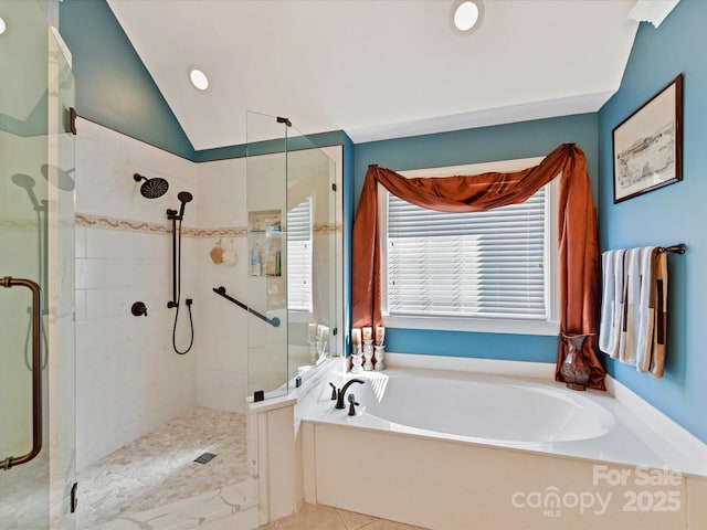 bathroom with lofted ceiling, tile patterned flooring, a shower stall, and a bath