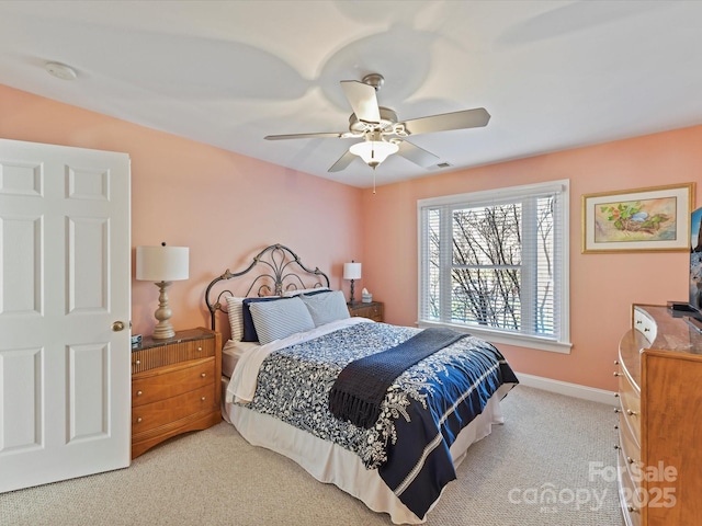 bedroom with carpet, baseboards, and a ceiling fan