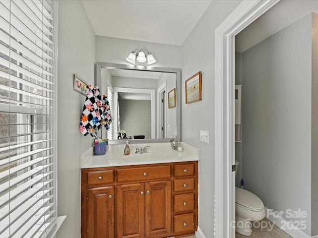 bathroom with vanity and toilet