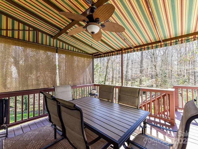 wooden deck with ceiling fan and outdoor dining space