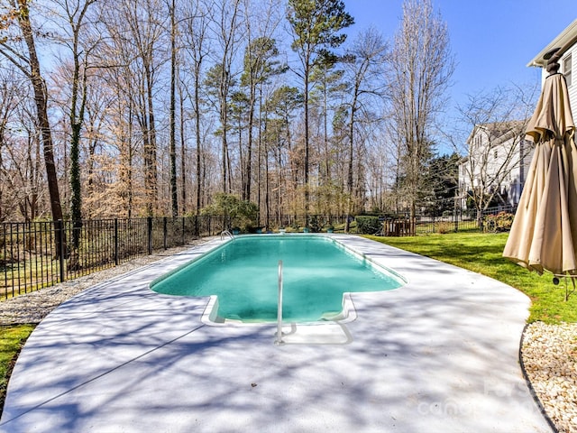 view of pool featuring a fenced in pool, a fenced backyard, and a patio