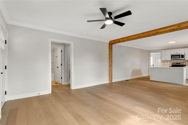 unfurnished living room featuring light wood-style floors, crown molding, baseboards, and ceiling fan