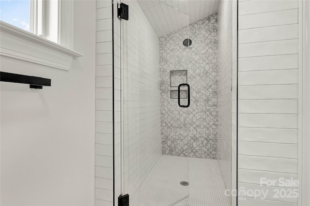 full bath with vaulted ceiling and a shower stall