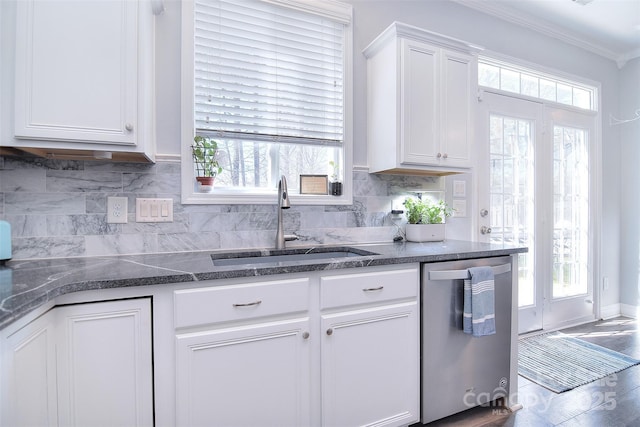 kitchen featuring a sink, white cabinets, stainless steel dishwasher, crown molding, and backsplash