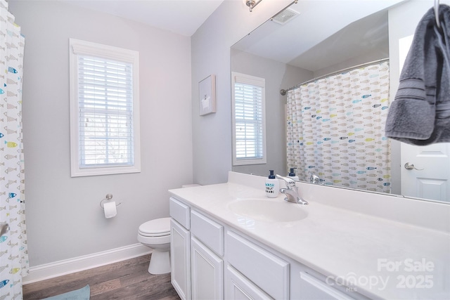 full bath featuring visible vents, baseboards, toilet, wood finished floors, and vanity