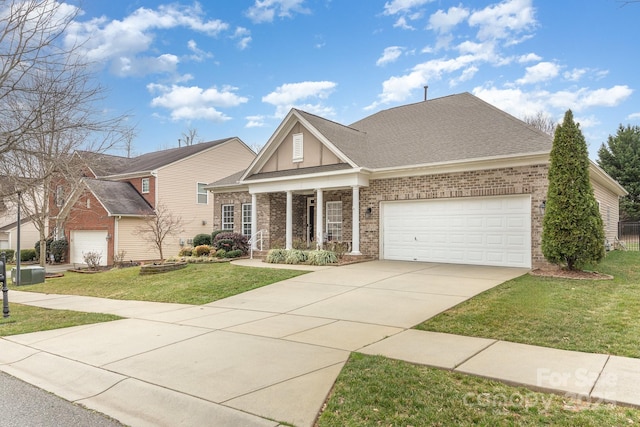 view of front of property with an attached garage, concrete driveway, brick siding, and a front yard