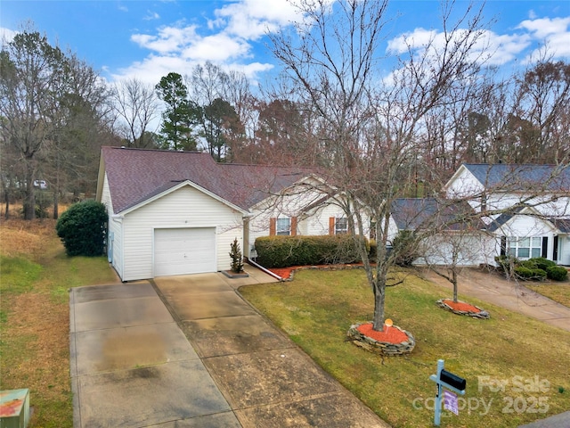 view of front of property featuring a front lawn, an attached garage, driveway, and roof with shingles